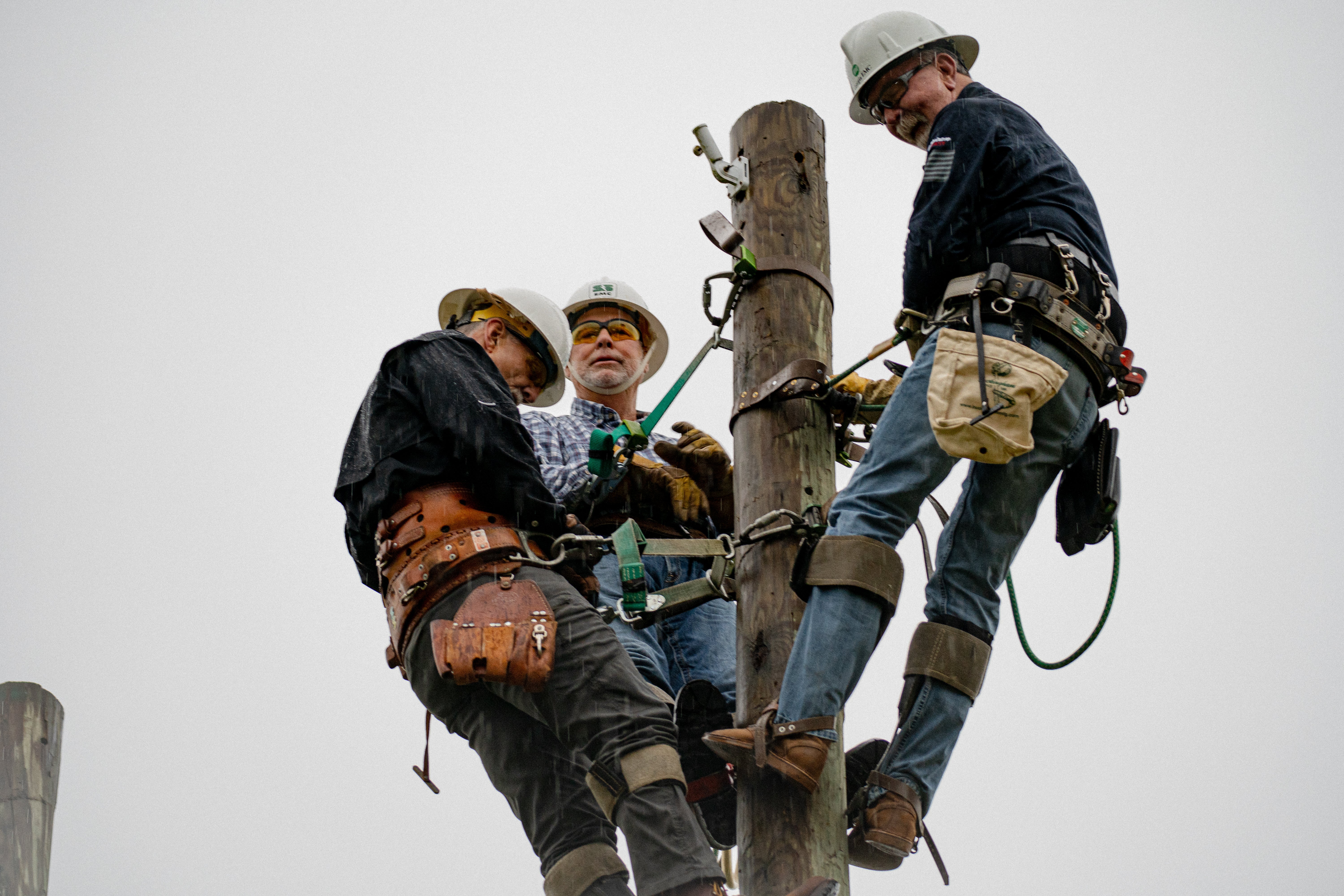 Victor Hurst, Don Ritchey and Harry Reeves climb together for the opening flag ceremony.