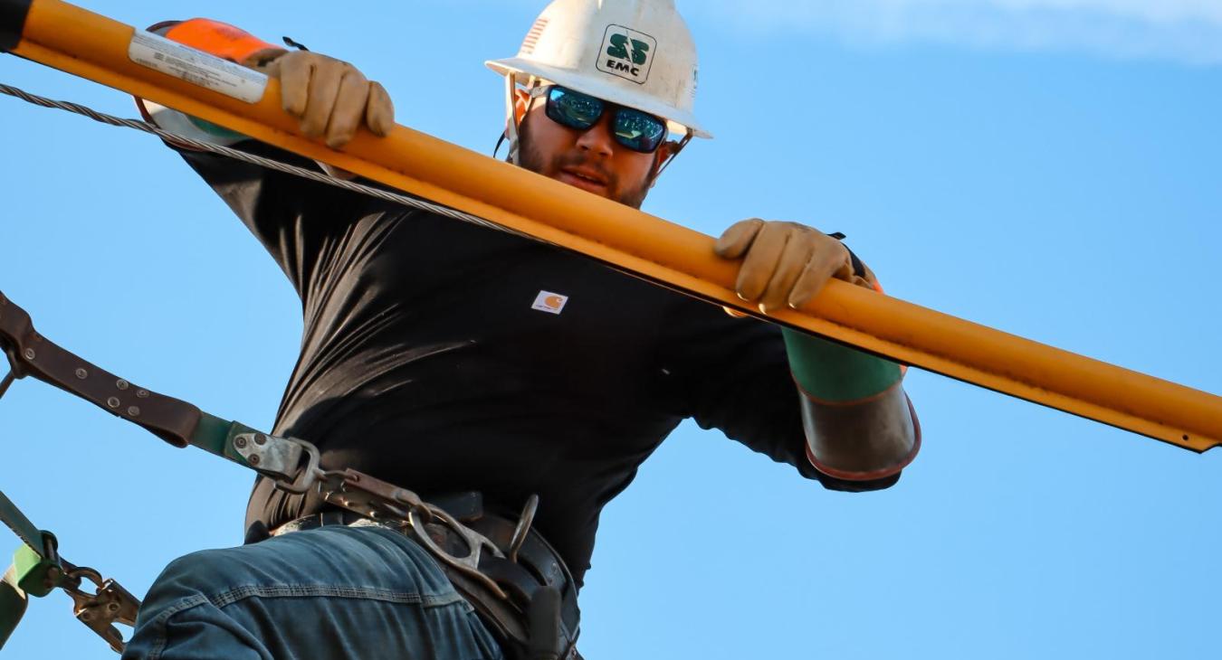 Lineman during competing event with safety equipment
