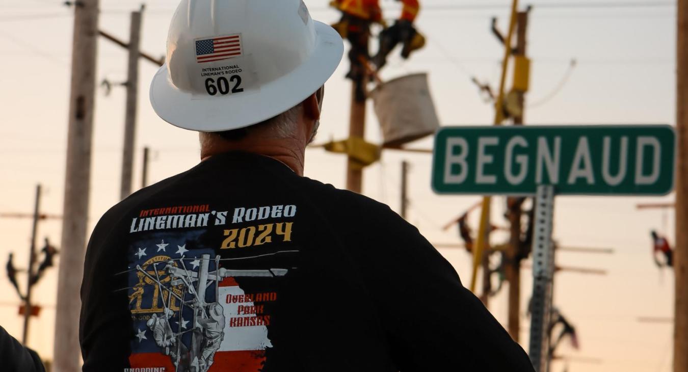 Lineman looking on as others compete